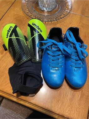 Umbro Neon Yellow and Black Shin Guards with Blue Soccer Cleats